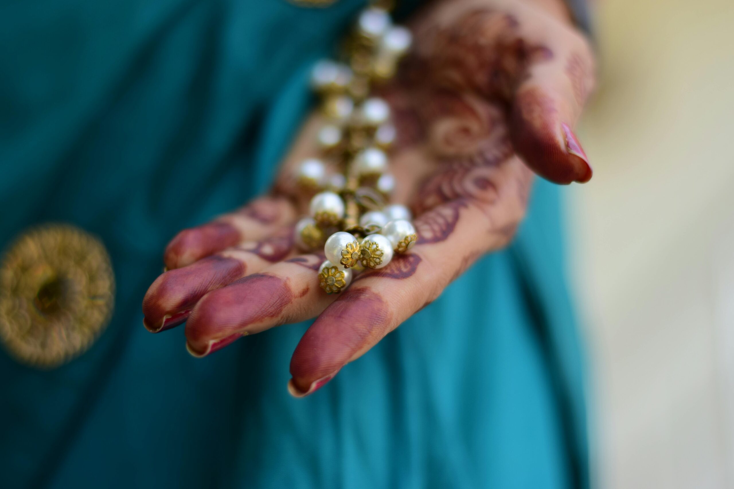 Pearl Jewelry Contrasts Well Even On Hands With Intricate Henna